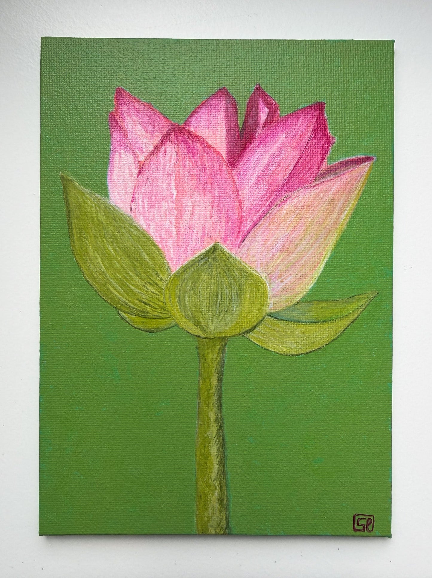 A painting of a pink lotus flower and stem against a bright green background
