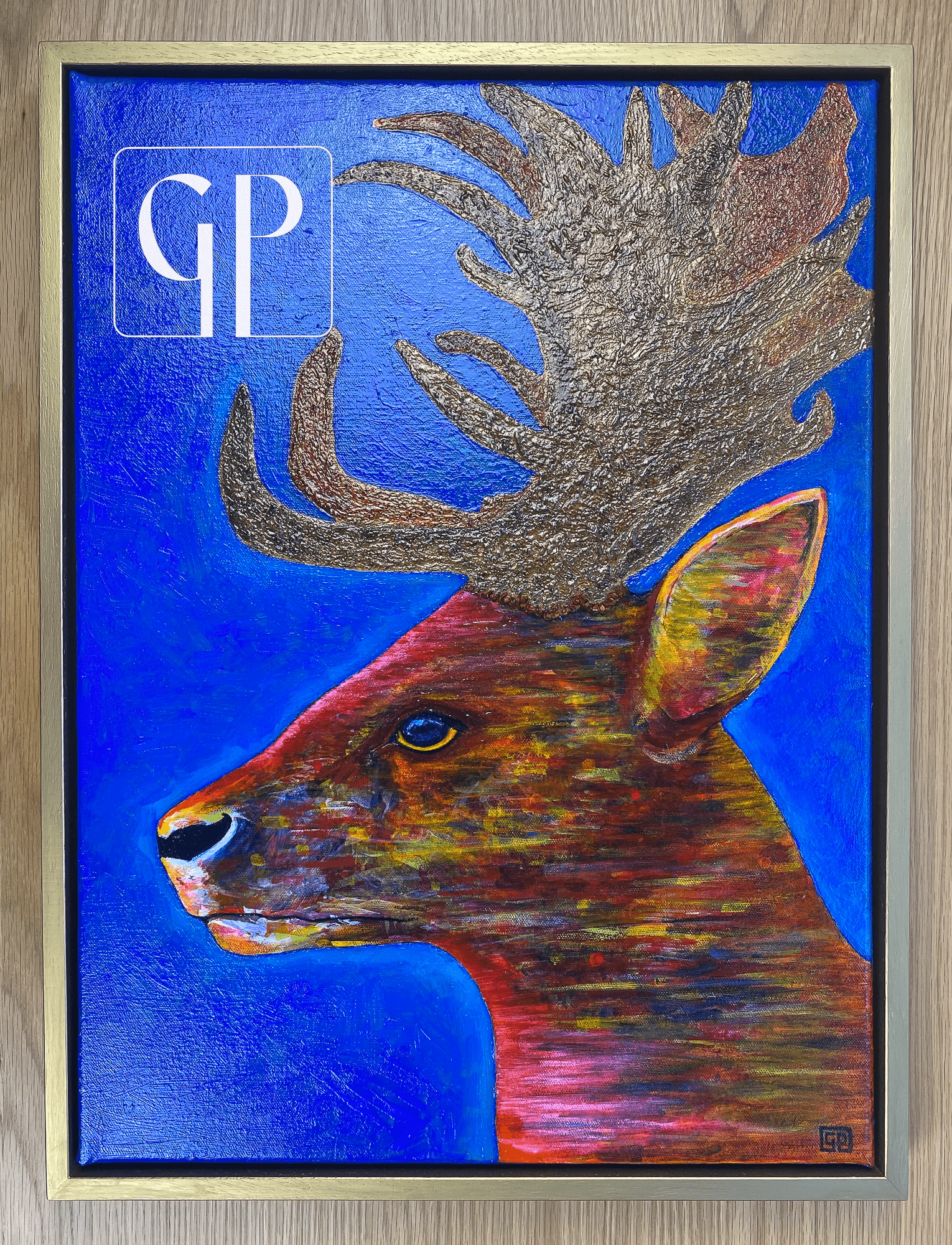 ORIGINAL - Ceryn: A deer with the glow of car lights & neon street lamps reflected on his coat.